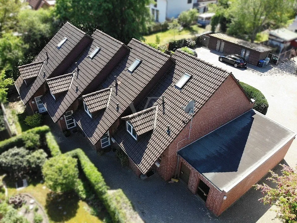 Joli ensemble de maisons mitoyennes comprenant quatre unités résidentielles