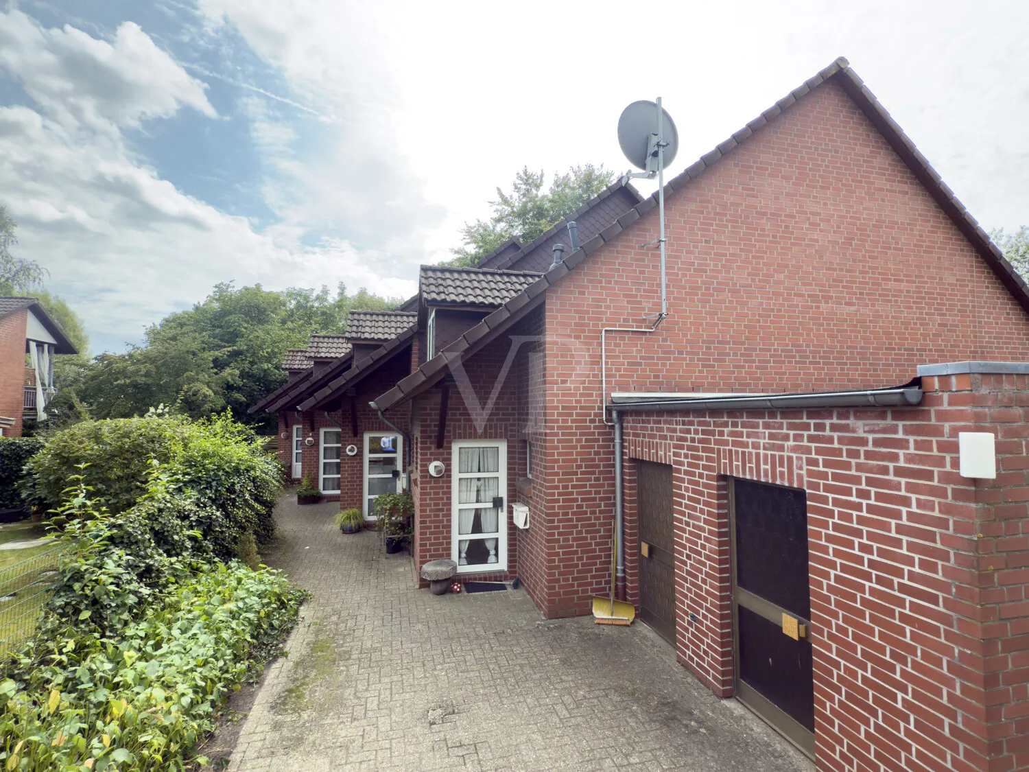 Joli ensemble de maisons mitoyennes comprenant quatre unités résidentielles