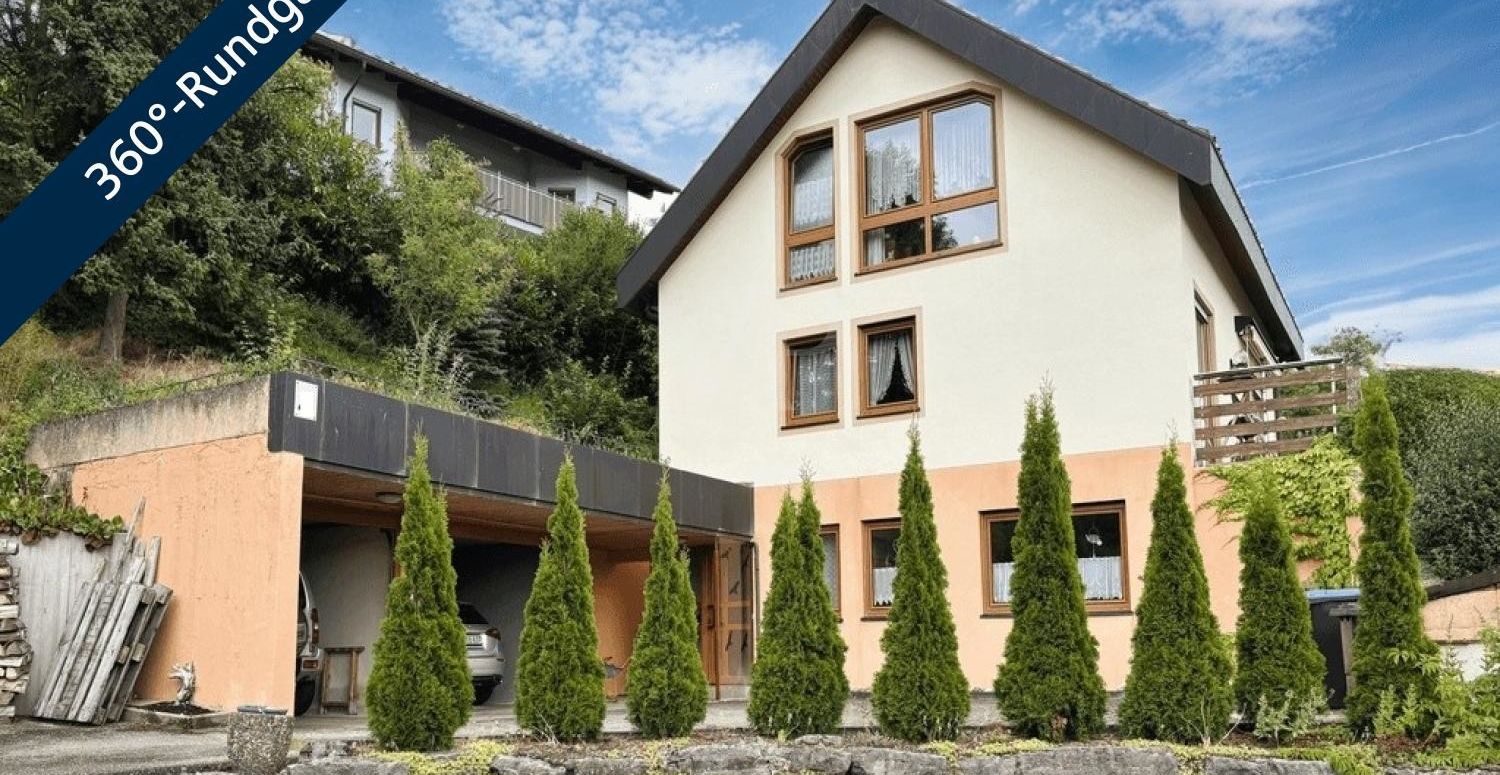 Einfamilienhaus mit Einliegerwohnung, Doppelgarage und Aussicht