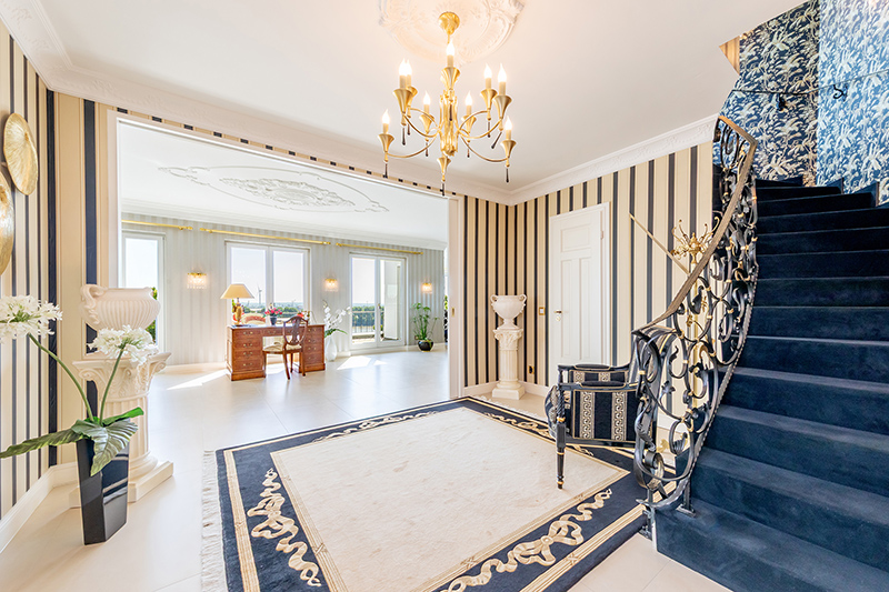 Hallway with guest toilet and stairs leading up to the mezzanine floor