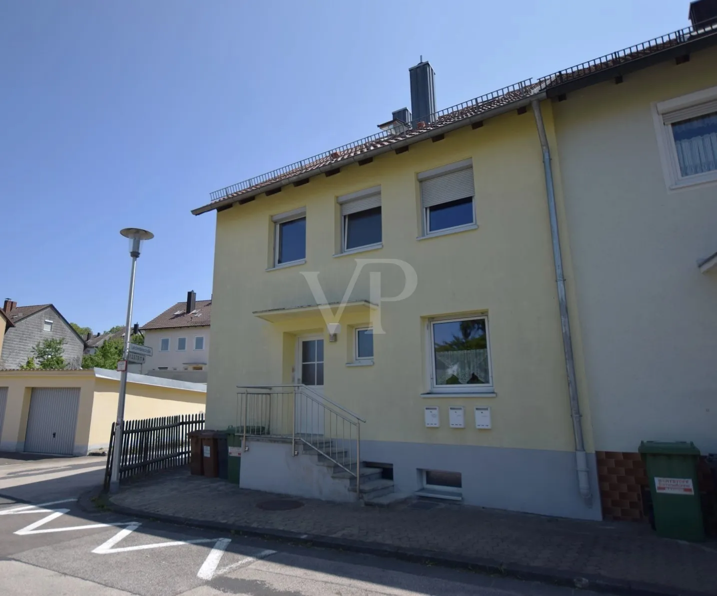 Modernized multi-family house with three rented residential units and a garage