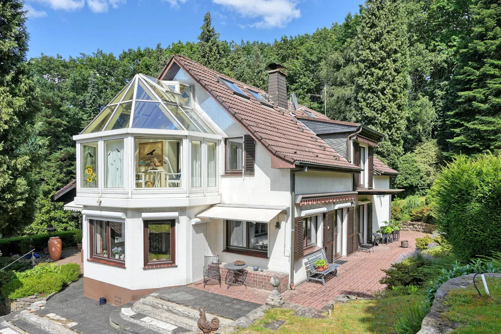 Detached country-style house on park-like grounds in a secluded location