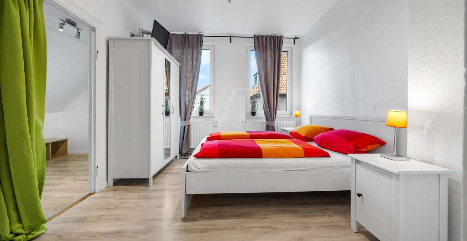 Das Schlafzimmer Wohnung 1 im Obergeschoss