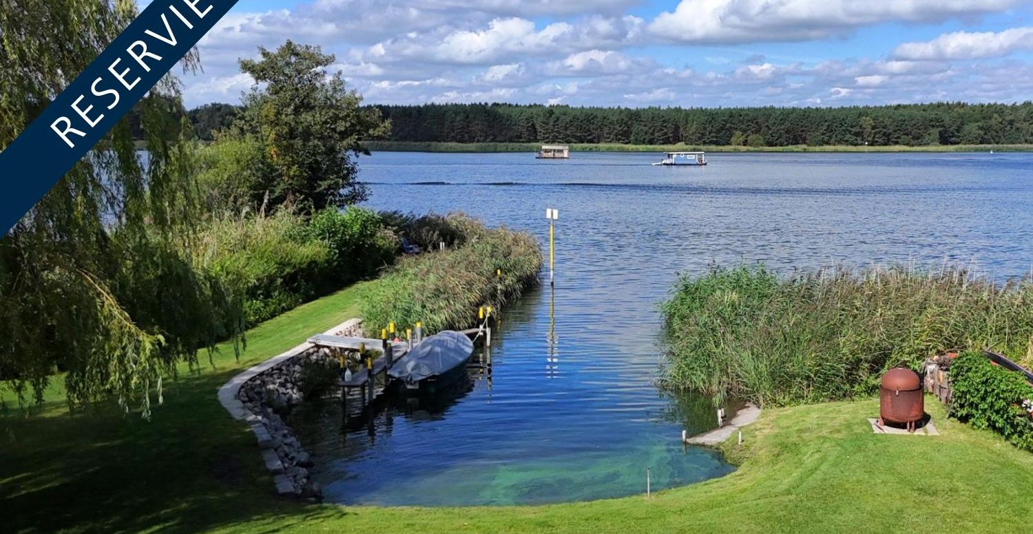 Exklusives Wassergrundstück – Wohnhaus, Ferienhaus, Bootshaus und Steganlage mit eigenem Strand