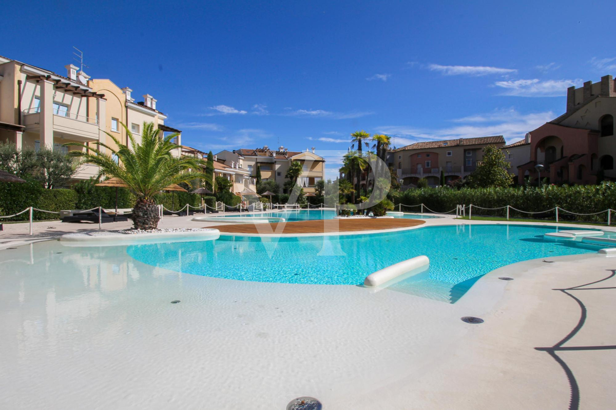 Two-room ground floor apartment in residence with central swimming pool