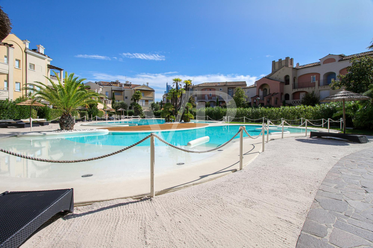 Two-room ground floor apartment in residence with central swimming pool