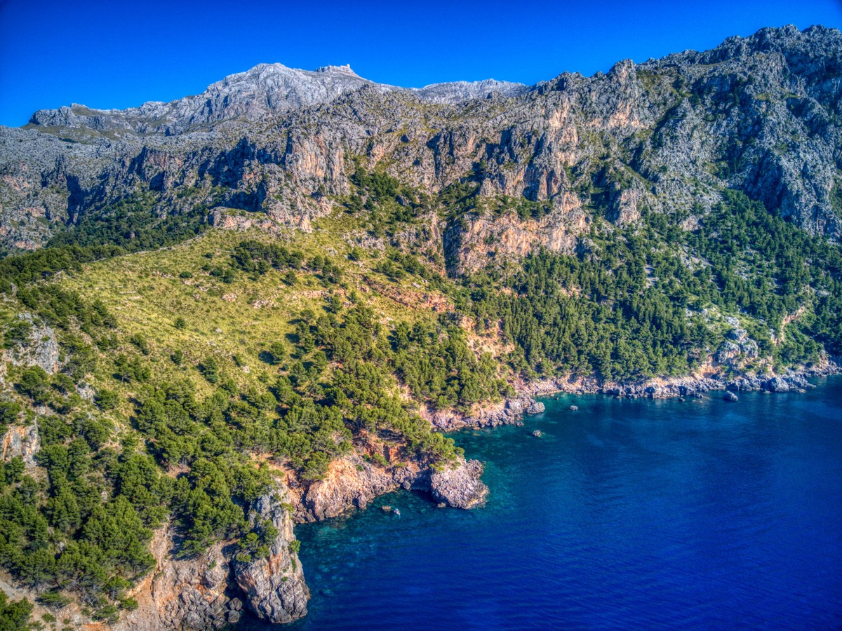 Vast and breathtaking coastal landscape in the first line of the sea in the heart of the Unesco World Heritage Tramuntana between Cala Tuent and Soller