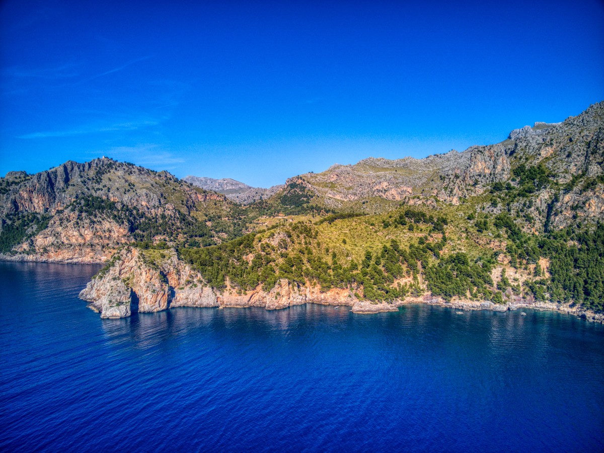 Vast and breathtaking coastal landscape in the first line of the sea in the heart of the Unesco World Heritage Tramuntana between Cala Tuent and Soller