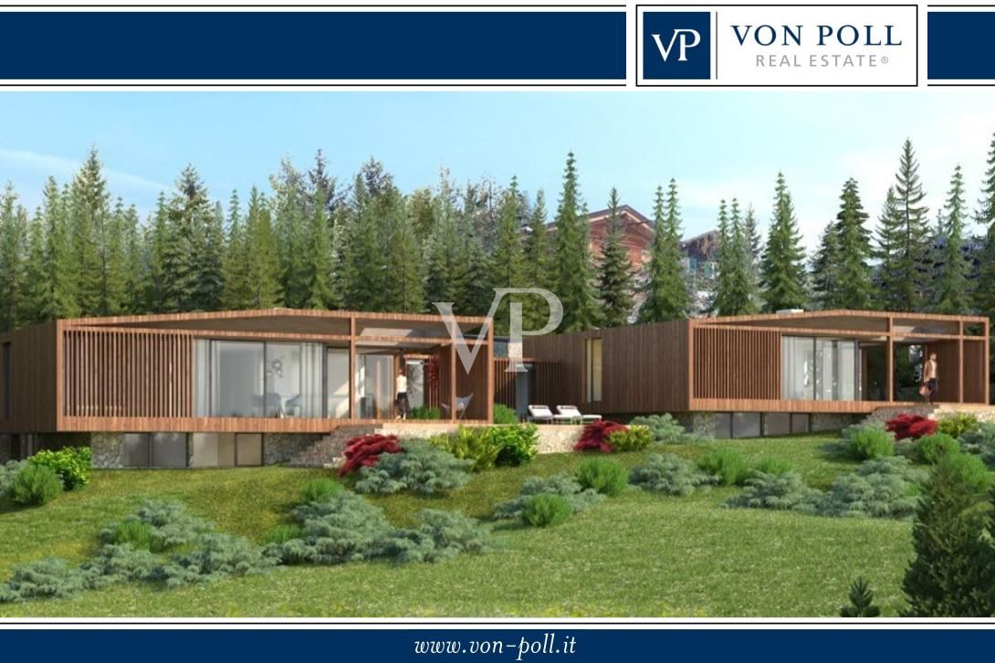 Dos villas de nueva construcción en estilo alpino, directamente en el campo de golf de Petersberg