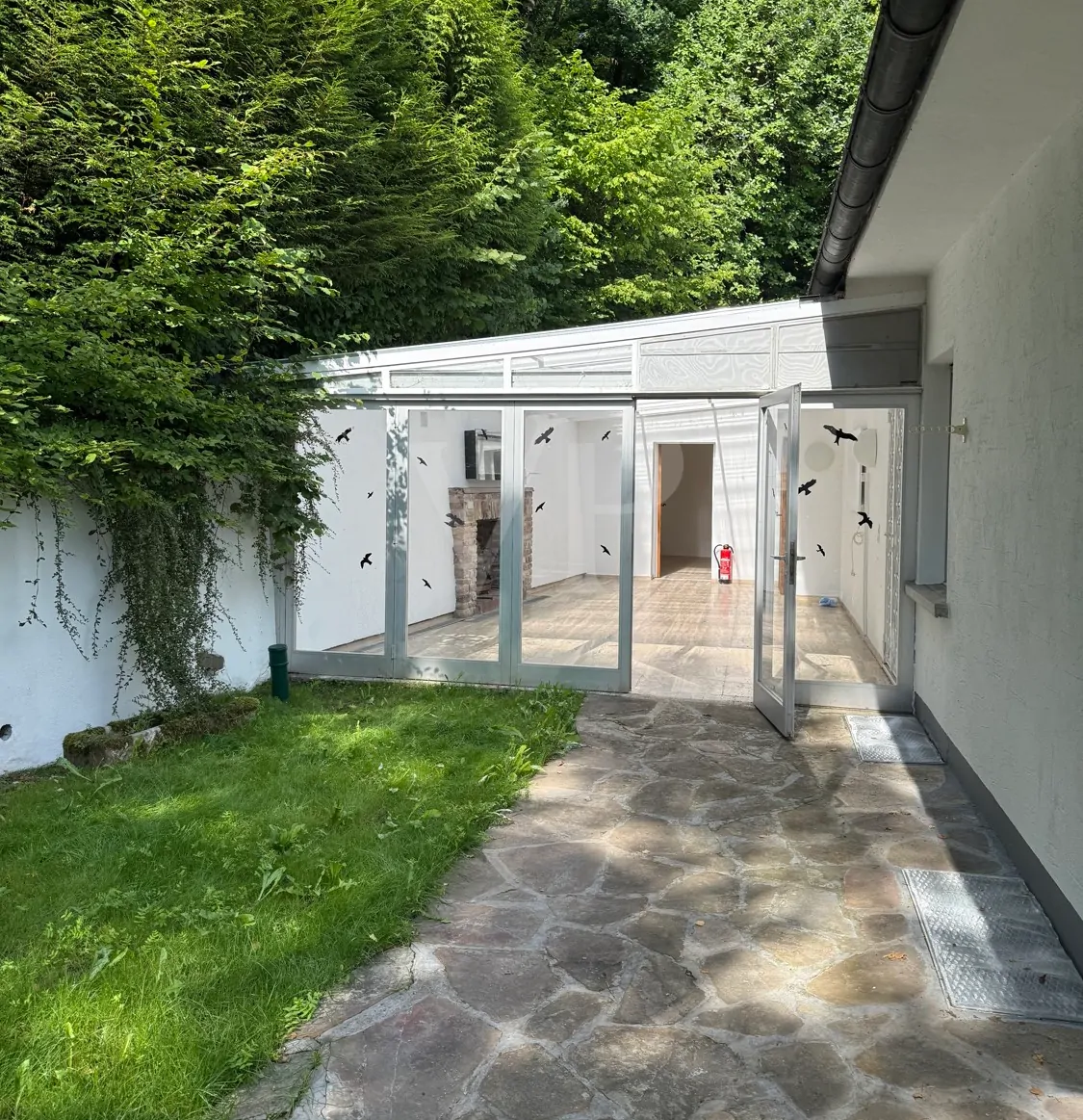 Wintergarten Eingang vom Garten