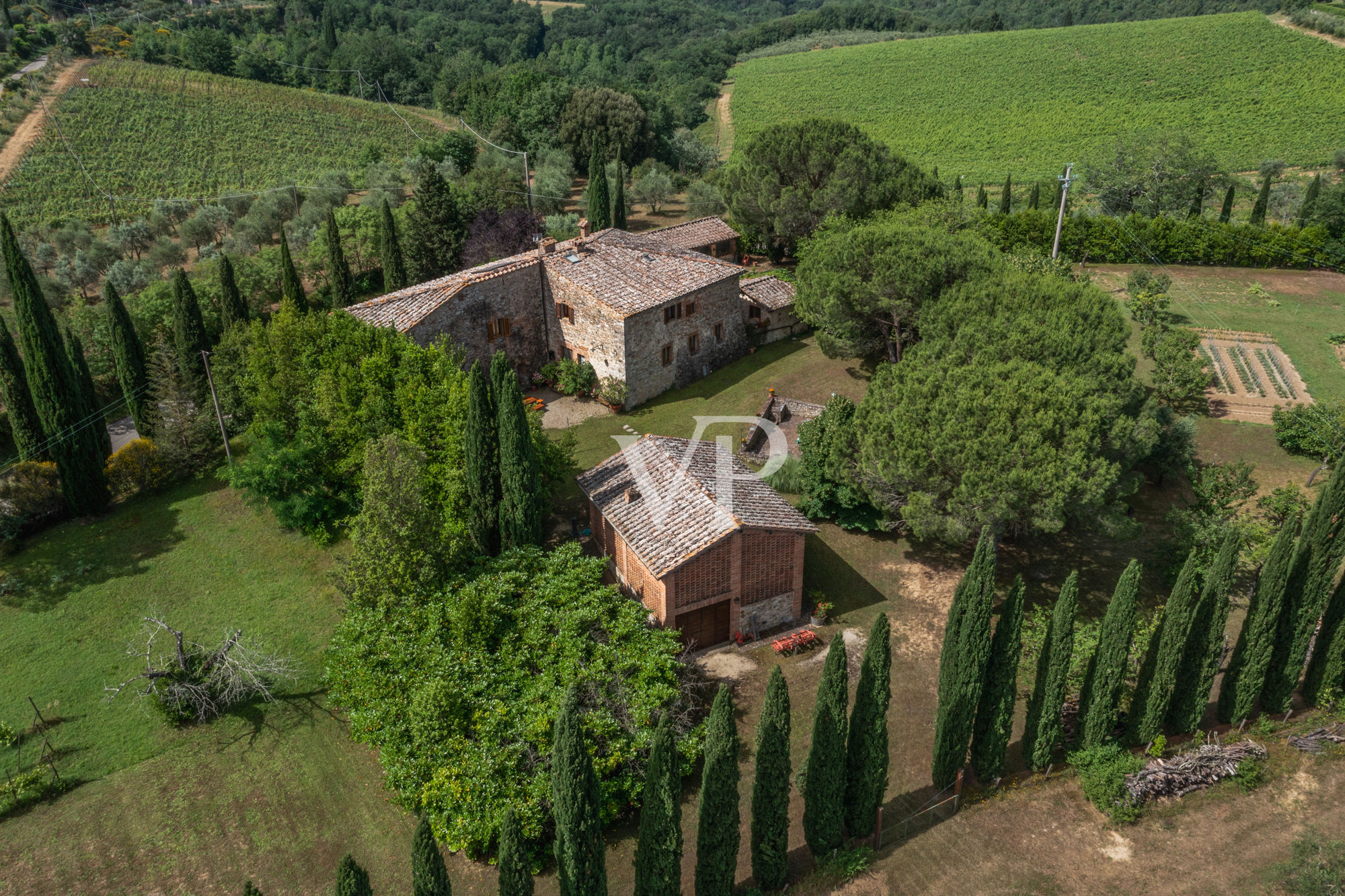 Chianti, Tuscany: magnificent historic estate with independent villa and two outbuildings surrounded by greenery