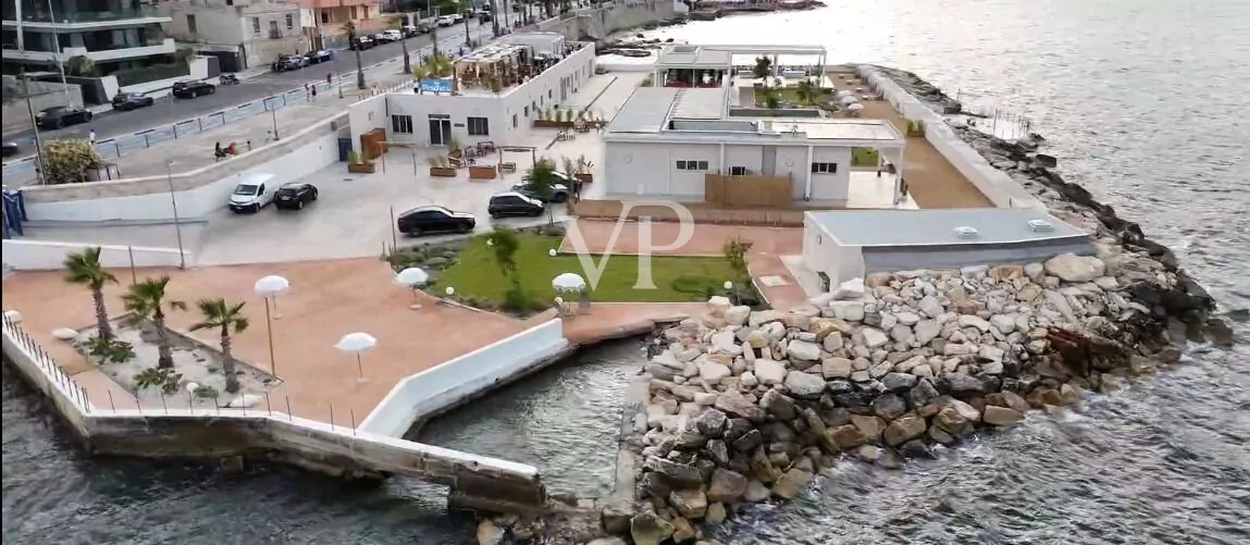 Unique commercial complex with bar, restaurant, and fish market in an exclusive location on the waterfront