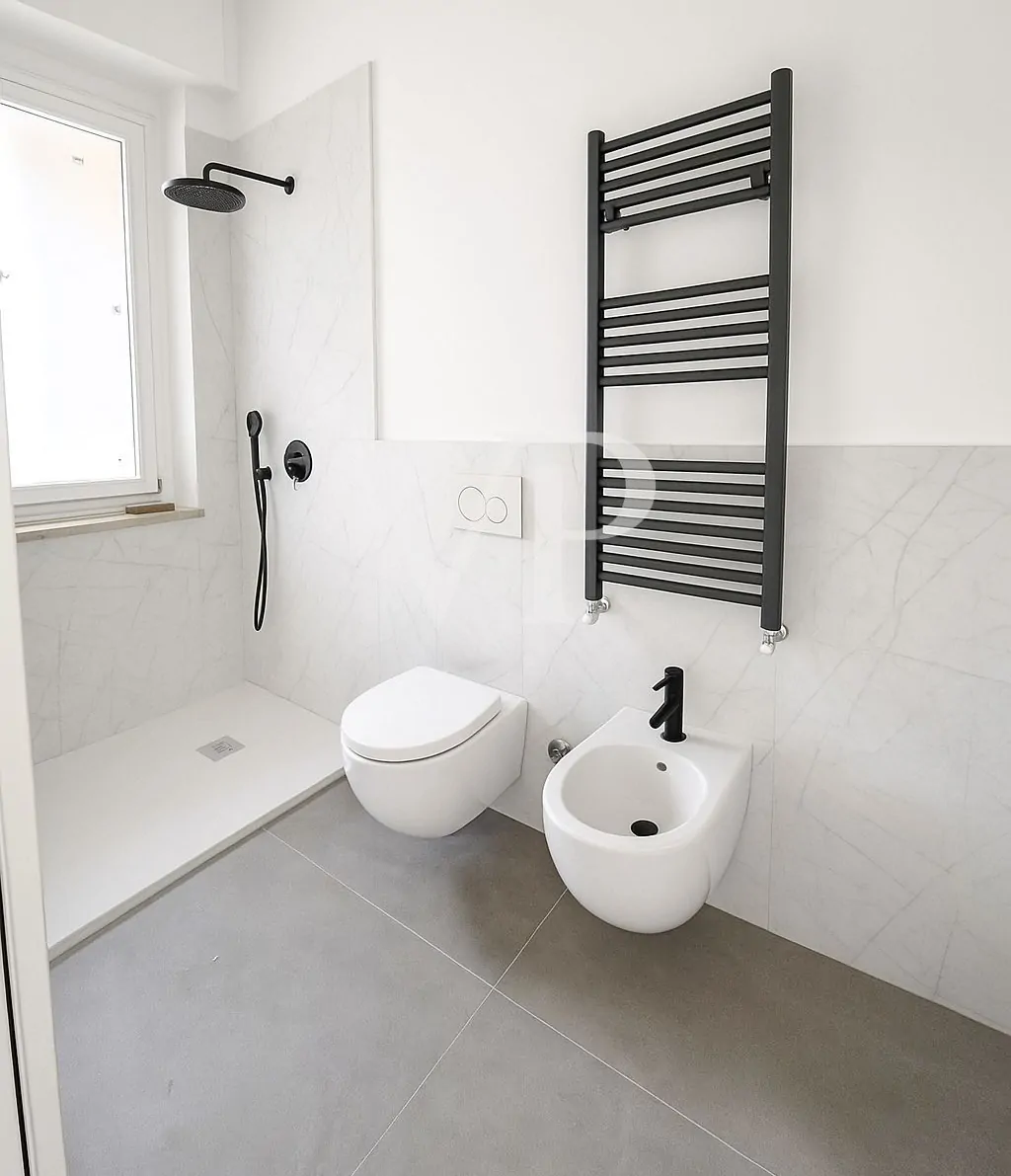 Quadrilocale finemente ristrutturato con due balconi