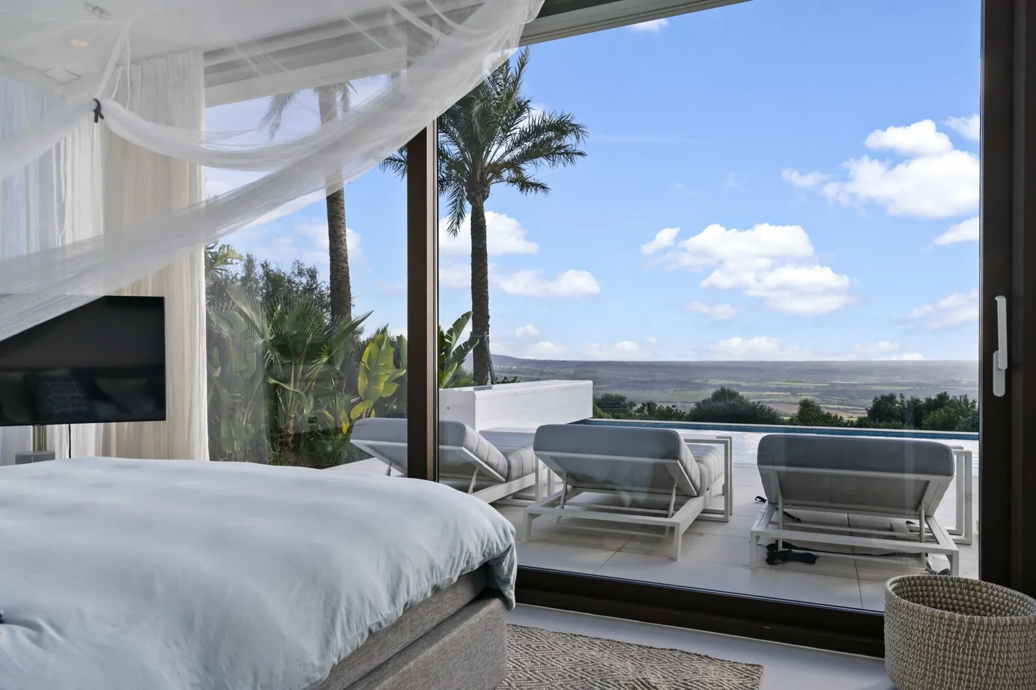 Bedroom with access to the terrace and pool