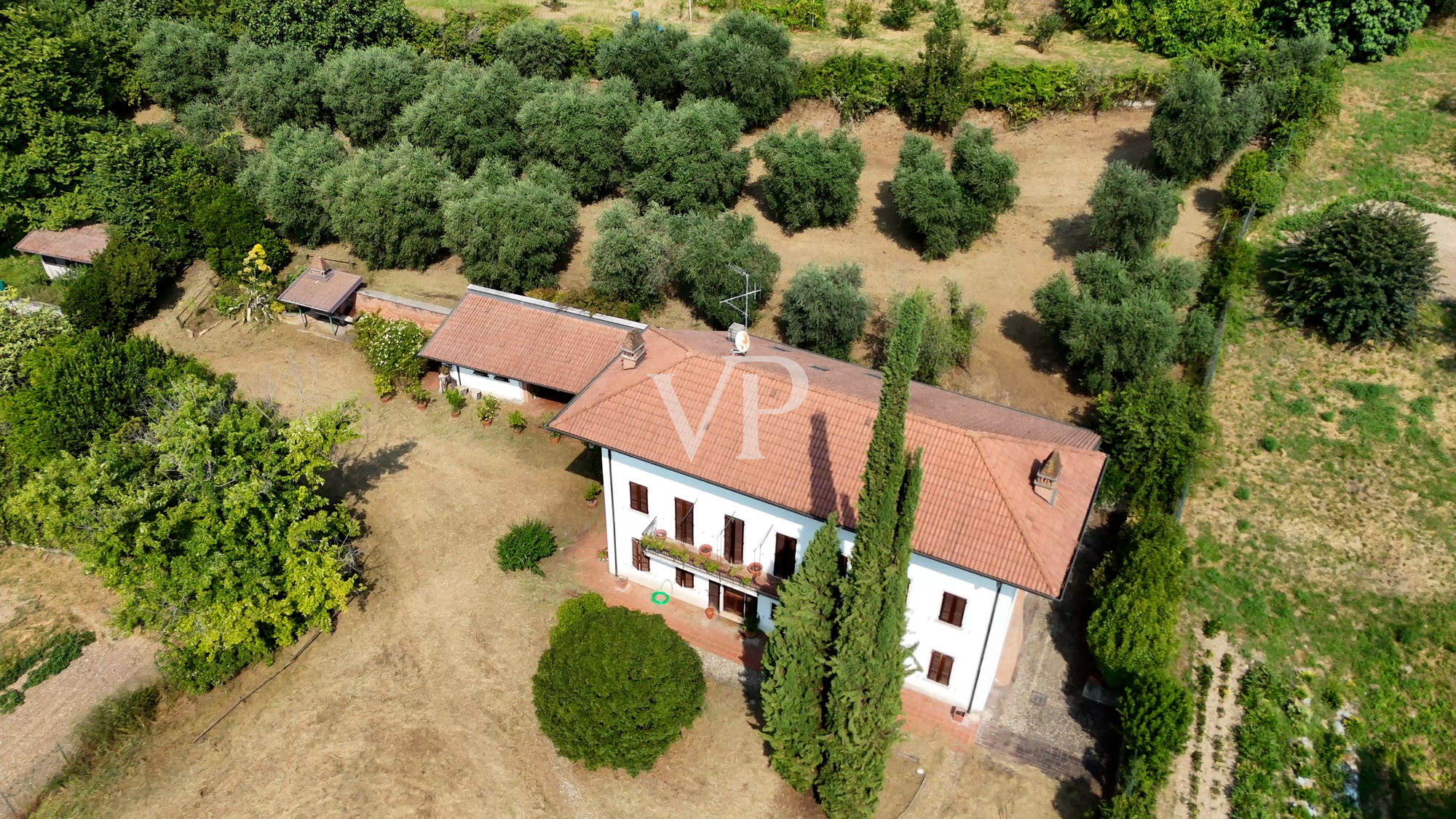 Beautiful farmhouse surrounded by greenery