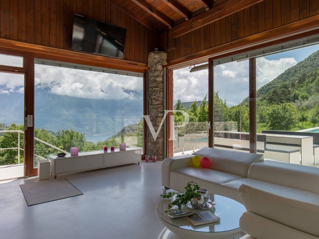 Luxurious and fully self-sufficient mountain chalet with infinity pool in a unique panoramic location with lake view.