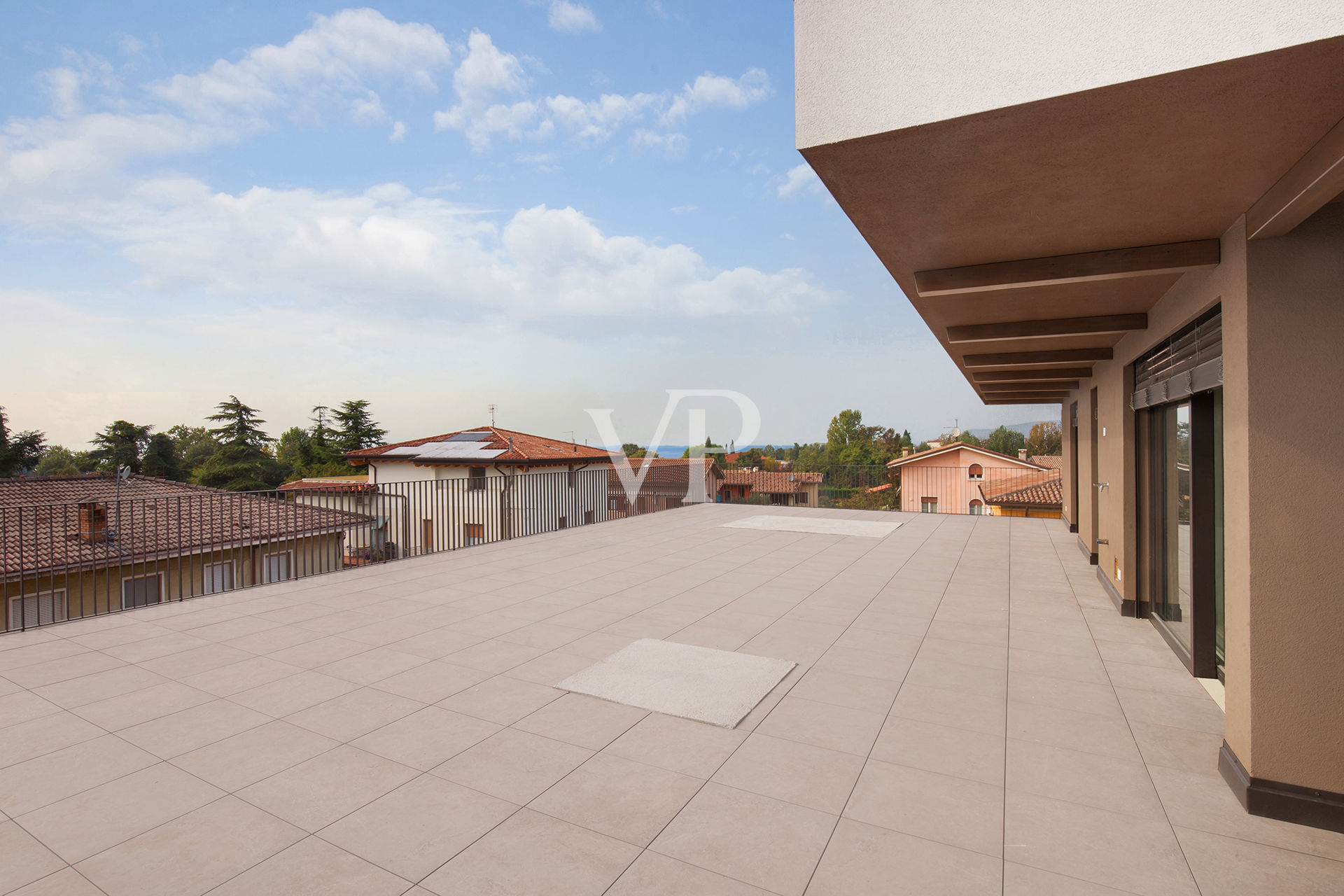 Above the rooftops of Lazise with a view of the lake