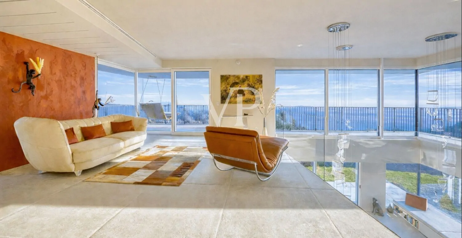 Villa contemporanea con vista panoramica sul Lago di Garda, immersa in uliveto privato