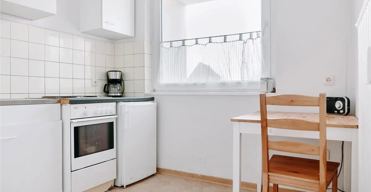 Küche mit Einbauschränken