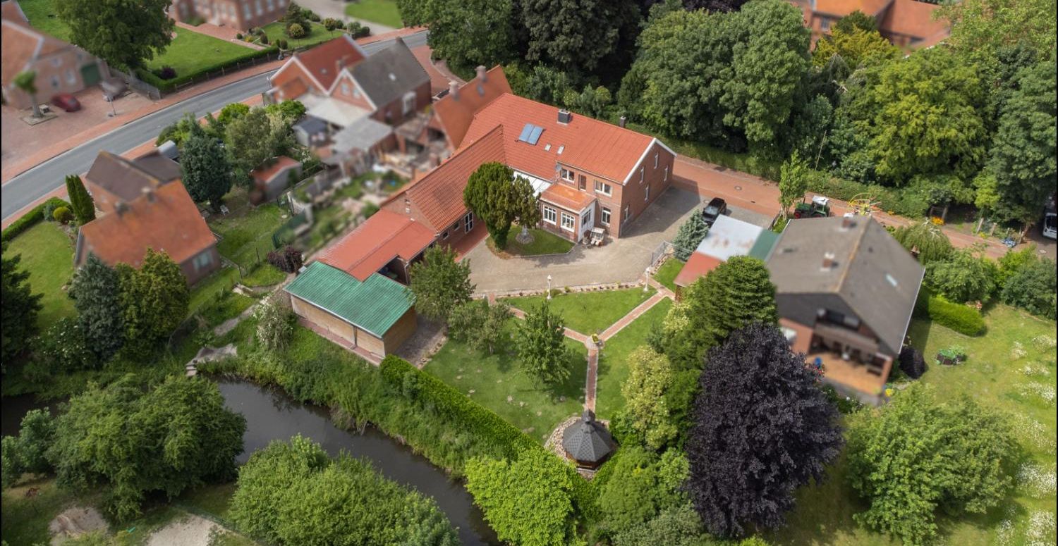 Großzügige Wohn- und Gewerbeimmobilie mit Gartenidylle am Wasser